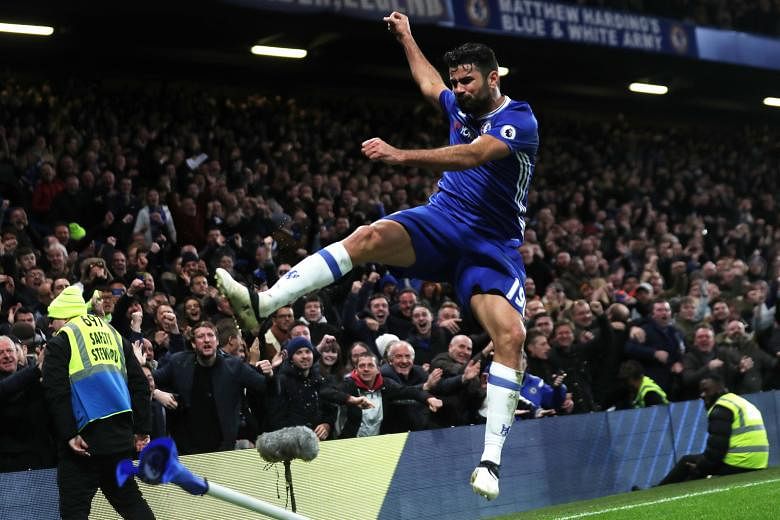 Diego Costa celebrating after scoring Chelsea's fourth goal in the 4-2 win over Stoke on Saturday. He is the Premier League's current leading scorer with 14 goals.