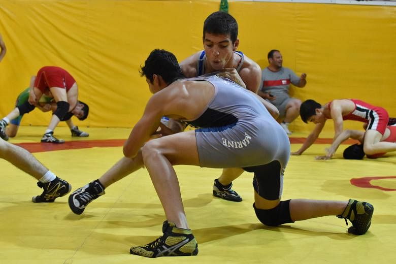 Close to 100 wrestlers train at the Nategh Nouri gym in Teheran. Wrestling accounts for 43 of Iran's 69 medals at the summer Games.