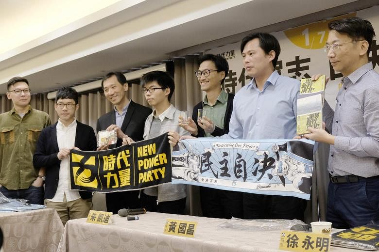 (From left) Taiwan Sunflower Movement leader Lin Fei-fan, Hong Kong politicians Nathan Law, Edward Yiu, Joshua Wong and Eddie Chu, and Taiwan lawmakers Huang Kuo-chang and Hsu Yung-ming at an event hosted by the New Power Party in Taipei on Sunday, a