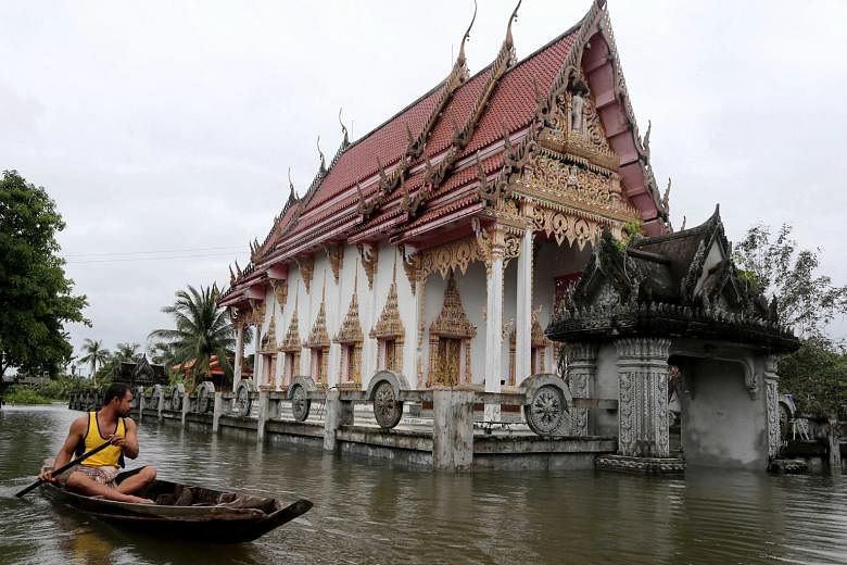 A flooded Buddhist temple in Nakhon Si Thammarat province, in southern Thailand, on Sunday. Since the start of the year, heavy rain has caused flooding across several provinces in the southern provinces, leaving at least 21 people dead and affecting 