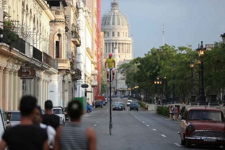 Cuban handyman Felix Guirola, 52, is paid to ride around Havana on homemade bicycles up to 7.5m tall which are decked out with advertising banners. The self-professed lover of heights recently turned his hobby into a livelihood when his two-wheeled s