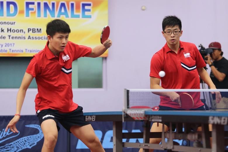 Clarence Chew (left) and Ethan Poh competing in the National Grand Finale men's doubles final against Pang Xue Jie and Bernard Tan. They won 11-9, 8-11, 11-5, 11-6.