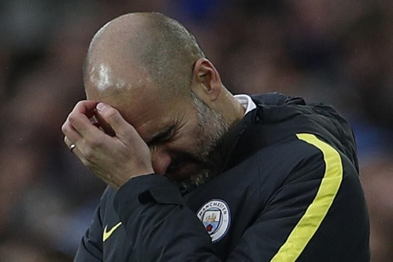 Pep Guardiola scratching his head as he seeks to turn Manchester City's fortunes around. His side have lost four of their last eight league games.