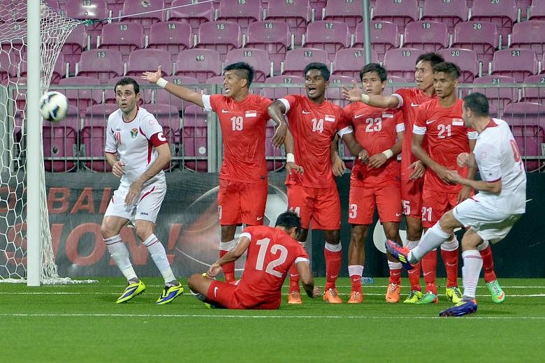 The Lions in action against Jordan in their 2015 Asian Cup qualifier at the Jalan Besar Stadium back in 2014. The Lions have never played in the finals except as hosts in 1984.