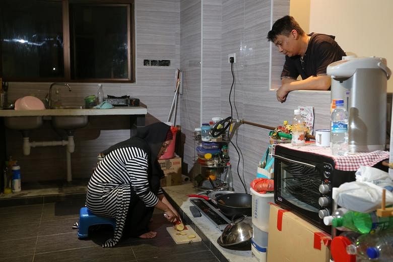 Mr Abdul Halil and his wife, Ms Stevanie Nur Rindyanie, in their renovated and fully furnished home. They had to live in a partially renovated flat (below) last year, after their interior designer left them in the lurch.
