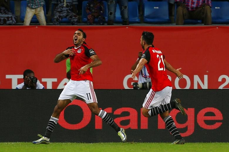 Egypt's Mahmoud Kahraba wheels away in jubilation after scoring in the 88th minute against Morocco. Egypt won 1-0 and will now face Burkina Faso in the semi-finals of the Africa Cup of Nations. Ghana take on Cameroon in the other semi-final.