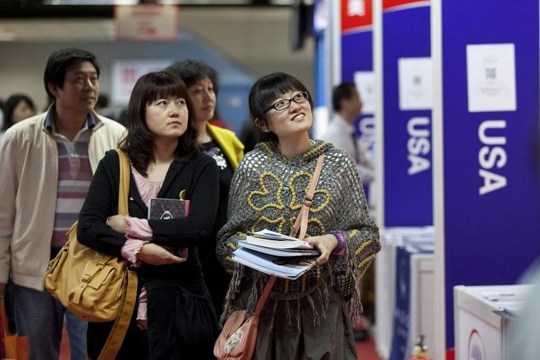 Chinese students and their parents at an education expo in Beijing. In 2005, only 641 Chinese students were enrolled in US high schools. By 2014, that student population was close to 40,000 - a sixty-fold increase in a single decade - and it now acco