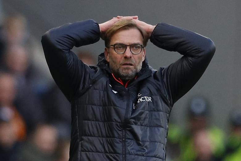 Liverpool manager Jurgen Klopp showing his frustration during his team's 0-2 loss to Hull on Saturday. The Reds are now fifth in the Premier League table and trail leaders Chelsea by 13 points.