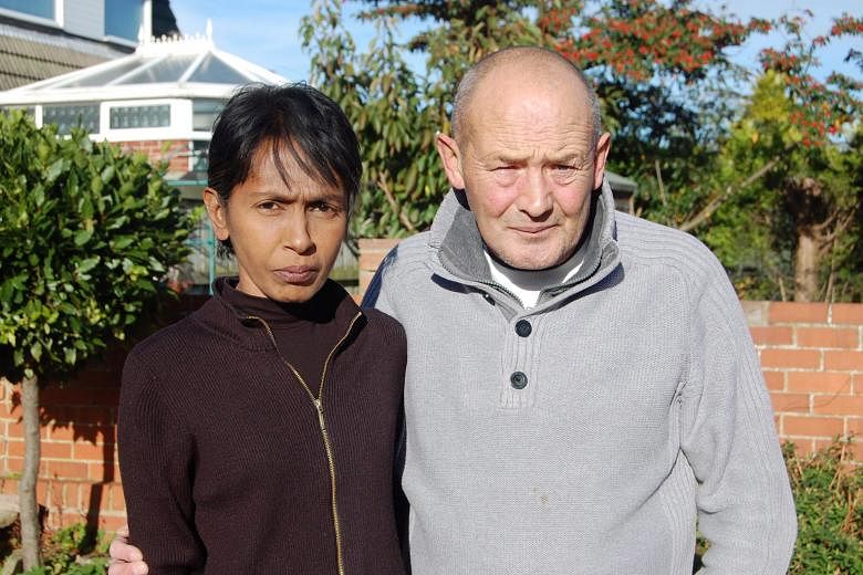 Mrs Irene Clennell and her husband John in a photo taken last year, after finding out that she was to be deported to Singapore. She is fighting to be allowed to remain in Britain with her family.
