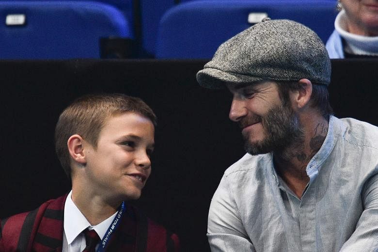 Former England footballer David Beckham and second son Romeo watching the ATP World Tour Finals in London last November. His team do not dispute some of the e-mails of him criticising the honours committee for not giving him a knighthood. But they st