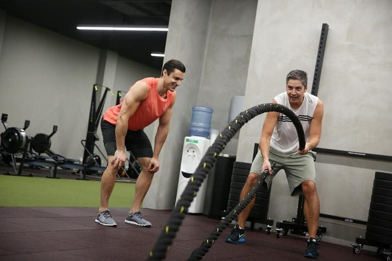 One FM 91.3 DJ Shan undergoing an arduous training session, conducted by TripleFit gym instructor Daniel de Sanctis in preparation for the upcoming Men's Health Urbanathlon.