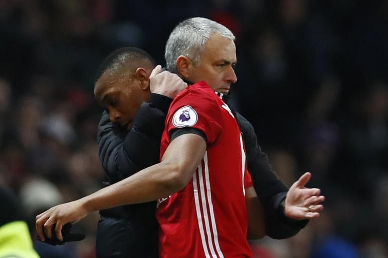 Anthony Martial is congratulated by United manager Jose Mourinho after being substituted. His goal and Juan Mata's opener secured the win.