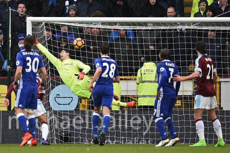 Chelsea's goalkeeper Thibaut Courtois cannot keep out Robbie Brady's masterful free kick which made it 1-1, marking the first time the Belgian had conceded directly from a free kick in the Premier League.