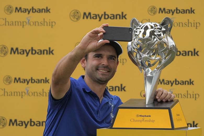 Paraguayan Fabrizio Zanotti taking a selfie with his trophy, after shooting "probably the best round" of his career at Saujana Golf and Country Club to win by one stroke.