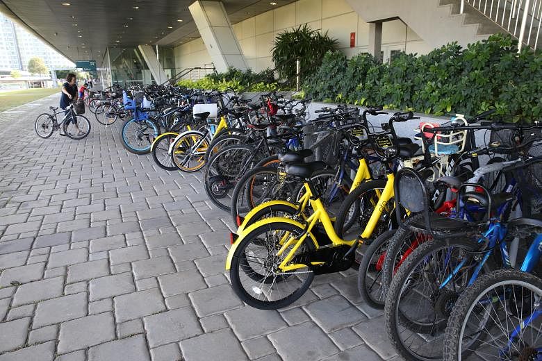 Chinese company ofo's bright yellow bicycles outside Punggol MRT station. Direct competitor Obike's white bicycles are already available for rent at almost every MRT station. Both plan to expand their fleet of bicycles. Experts reckon the two schemes