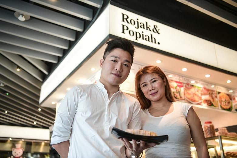 Mr Popiah's Madam Li and her son Lewis at their branch in Ang Mo Kio Hub. They are looking into further automating the popiah-making process. Currently, Mr Popiah is 70 per cent automated. The firm aims to achieve automation in Singapore and China by