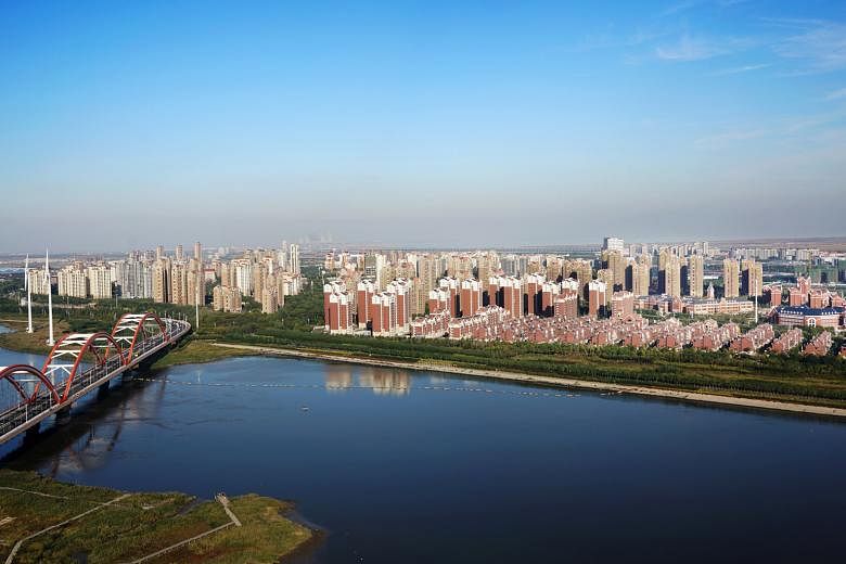 The Keppel conglomerate's involvement in the Tianjin Eco-City (above) and CapitaLand's role in Guangzhou's Datansha island project (left) have been cited as overseas examples of local industry players' track records, as they eye a master- developer m