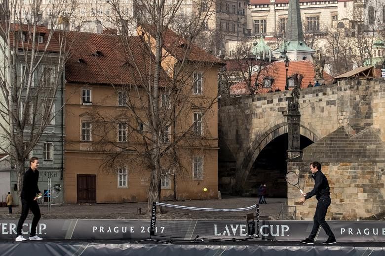 Swiss great Roger Federer (right) playing tennis with Czech Tomas Berdych on the Vltava River while promoting the Laver Cup, with Prague Castle in the background. The first Laver Cup, in honour of Australian legend Rod Laver, will pit six of the best