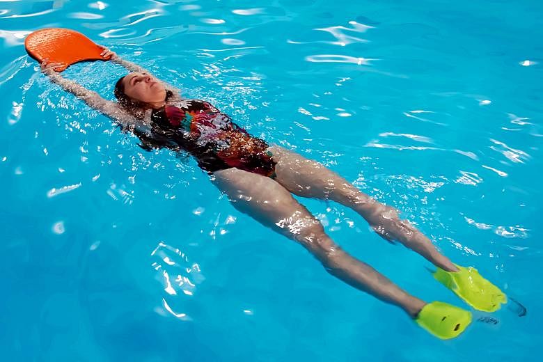 Swimming with fins allows you to work on your leg strength. Using different equipment in the pool, such as hand paddles, can also help you to work on your upper body.