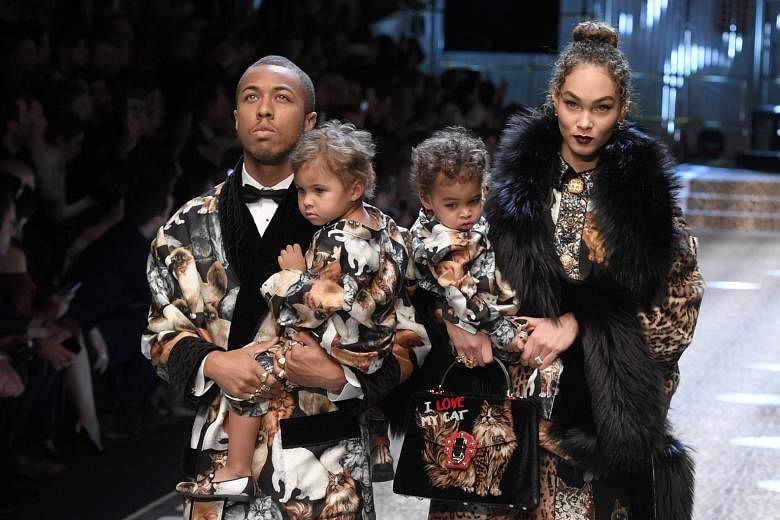 Model Amanda Harvey and her husband Jason with their children Noah and Rose as they walk the runway for fashion house Dolce & Gabbana during the Women's Fall/Winter 2017/2018 fashion week in Milan.