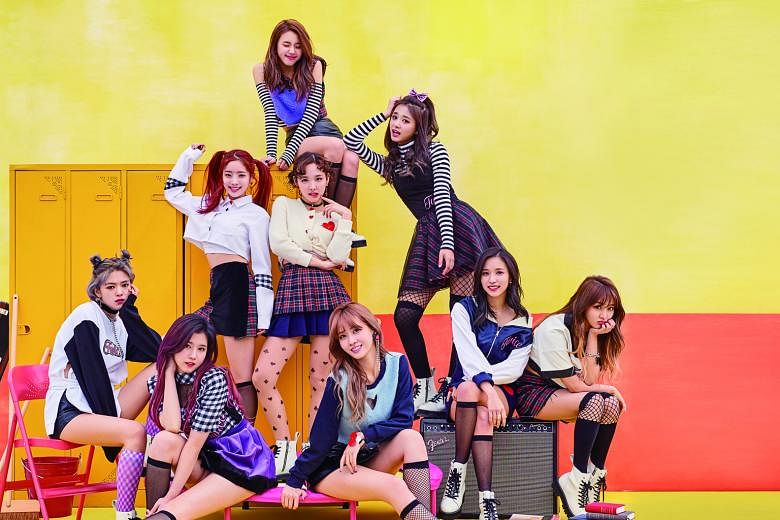 Girl group Twice comprise (front row, seated, from left) Jeongyeon, Sana, Momo, Mina, Jihyo, (second row, from left) Dahyun, Nayeon, Tzuyu and (last row) Chaeyoung.
