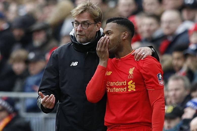 Jurgen Klopp instructing Daniel Sturridge before sending him on as a substitute in the FA Cup fourth-round loss to Wolves. Illness and inconsistent form have limited the forward's chances at Liverpool this season.