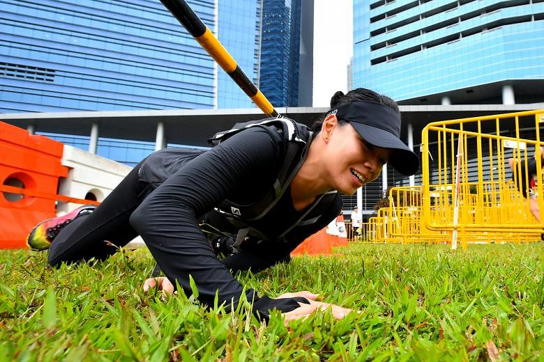 From top: A participant challenging himself at the Horizontal Salmon Ladder at Zone 4 at Ngee Ann City Civic Plaza. The Road Barricade at Zone 2 at the field opposite Marina Bay Financial Tower 3 is an obstacle which tests one's agility. The highligh