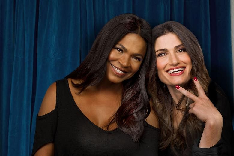Idina Menzel (right) takes on the role of CC Bloom in a made-for-television film reboot of Beaches, which also stars actress Nia Long (both above).