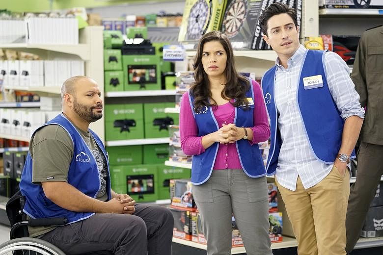 Actress America Ferrera, with Colton Dunn (far left) and Ben Feldman, in sitcom Superstore, where she plays an employee.