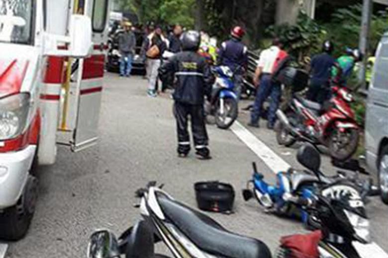 Some motorcyclists on the Bukit Timah Expressway had stopped on the road shoulder under a flyover to put on their raincoats when, according to Mr Chin Poh Fatt, one of the victims, a van drove into them.