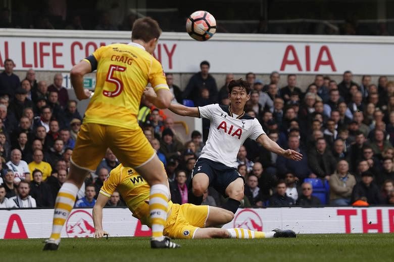 Son Heung Min curling his shot for Tottenham's second goal in the 41st minute. The South Korean international scored his first hat-trick for Spurs in a 6-0 demolition job over Millwall to move into the FA Cup semi-finals, with Arsenal and Manchester 