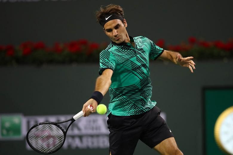 Roger Federer playing a forehand shot in his straight-sets victory against Stephane Robert, whom he met for the first time. He and fellow tennis great Rafa Nadal must both win their third-round matches in order to face off in the round of 16.