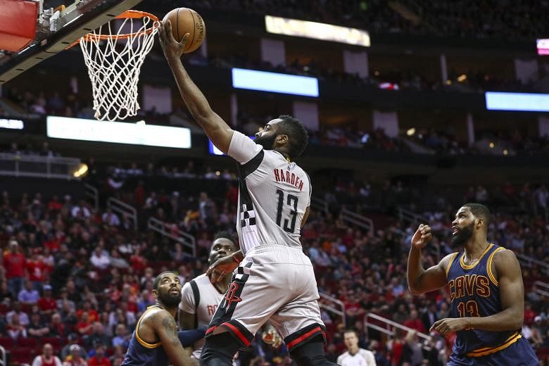 Houston's James Harden scoring a basket during the first quarter against Cleveland at Toyota Centre. The Rockets beat the Cavs 117-112.