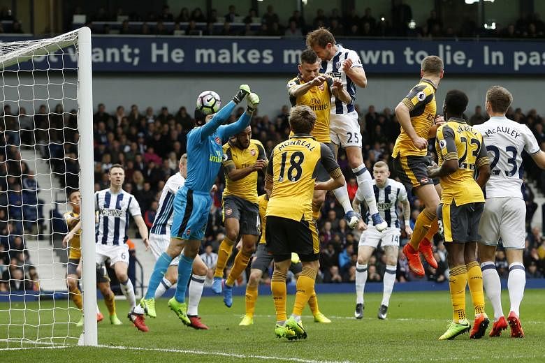 Craig Dawson heading in to give West Brom the lead against Arsenal. He wrapped up the 3-1 win with another header late in the game. The Gunners stay five points behind Liverpool in the battle for the final Champions League spot.