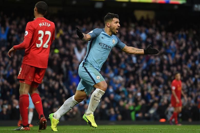 Manchester City striker Sergio Aguero turning away in celebration after equalising in the 69th minute as City drew 1-1 with Liverpool at home. Only one point separates both teams.