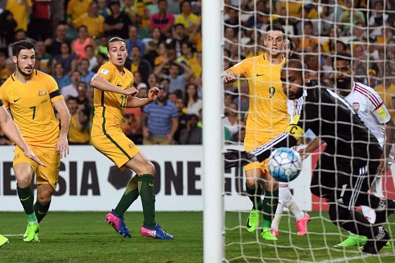 Jackson Irvine (second from left) and team-mates (from left) Mathew Leckie and Tomi Juric watching the ball cross the line from his header for the first goal.