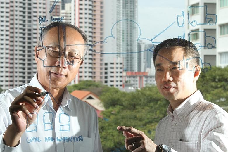 Mr Seah (right), Enhanzcom's CEO, with SIMTech's senior scientist Dr Song. Enhanzcom helps SMEs digitise their workflow using Fitprise, a Web-based software solutions developed by SIMTech.