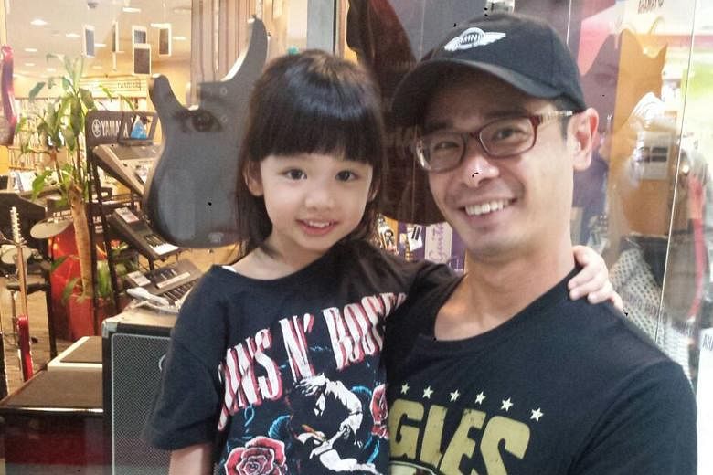 Sebastian Tan Gee How with his seven-year-old daughter. He is one of four independent candidates for the April 29 FAS election and says he wants to highlight areas of the game that do not get enough exposure, like primary school football.