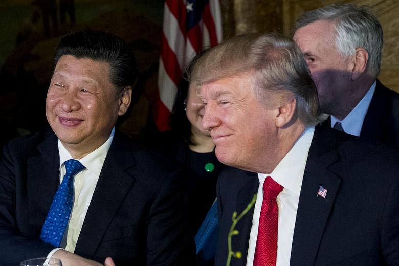Mr Donald Trump and Mr Xi Jinping shook hands and smiled broadly for the cameras during a dinner at the Mar-a-Lago resort in Florida on Thursday.