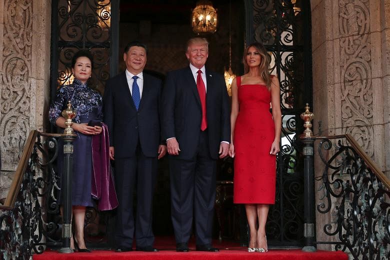 US President Donald Trump and First Lady Melania Trump with Chinese President Xi Jinping and First Lady Peng Liyuan at the Mar-a-Lago estate in Palm Beach, Florida, on Thursday.