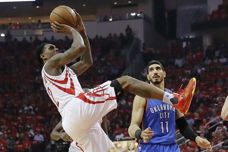 Houston's Lou Williams taking a shot while off balance, as Enes Kanter of Oklahoma City defends. The guard came off the bench to score 21 points, and the Rockets are up 2-0 in their Western Conference first-round play-off series after coming from beh