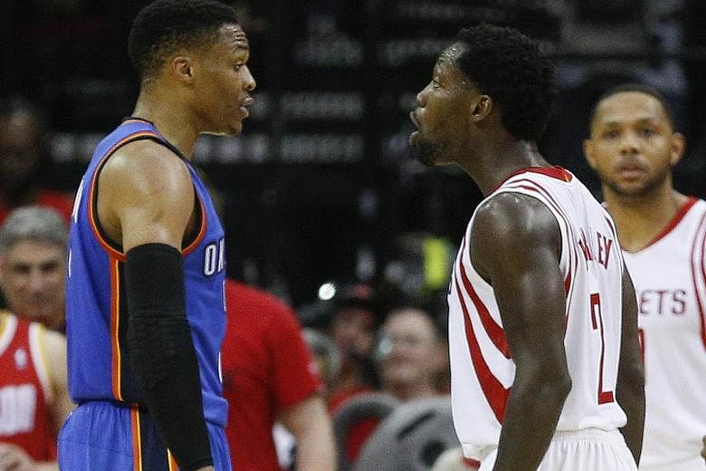 Oklahoma City Thunder's Russell Westbrook (left) and Houston Rockets' Patrick Beverley exchanging words during Game Five. Westbrook had 47 points but the Rockets won 105-99 to clinch the series 4-1.