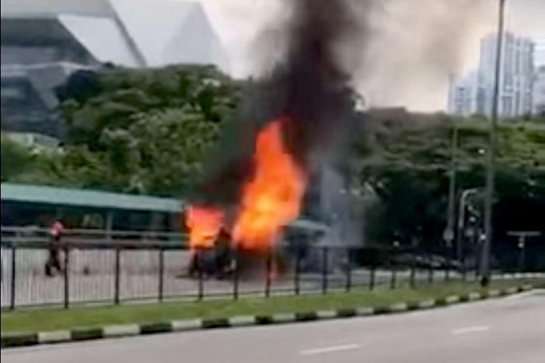 Screenshots from a video of the incident in Commonwealth Avenue showing the burning Trans-Cab taxi, which explodes and engulfs a fireman in flames. Preliminary investigations revealed that a road accident likely caused the blast.