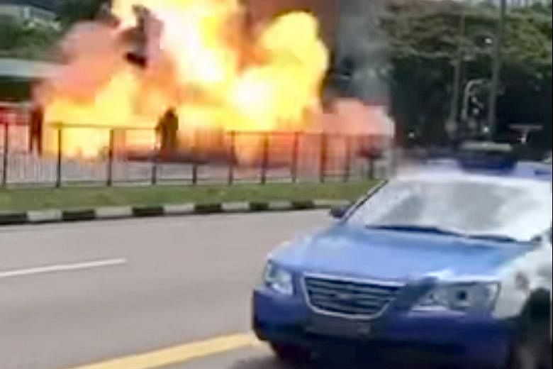 Screenshots from a video of the incident in Commonwealth Avenue showing the burning Trans-Cab taxi, which explodes and engulfs a fireman in flames. Preliminary investigations revealed that a road accident likely caused the blast.