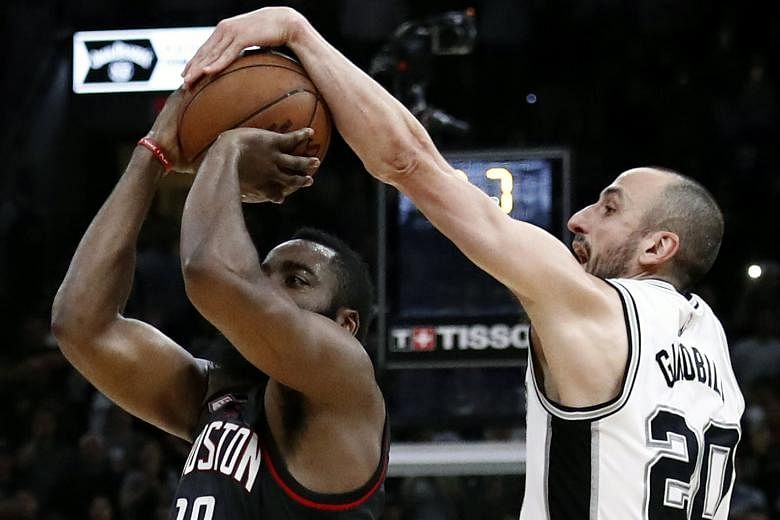 San Antonio guard Manu Ginobili blocking an attempted three-pointer by the Houston Rockets' James Harden just before the buzzer in overtime in Game Five of the Western Conference semi-finals. Spurs coach Gregg Popovich said the Argentinian veteran "w