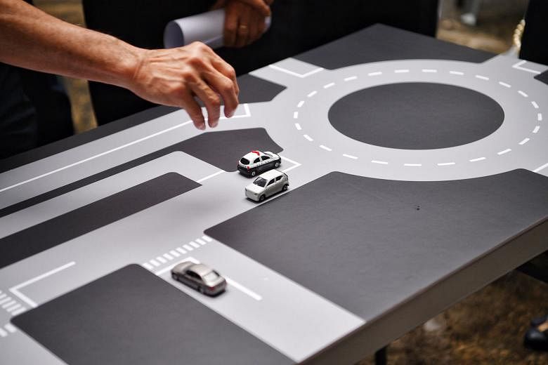 A re-created table-top map with toy cars showing how driving theory tests were held at the former Traffic Police headquarters.