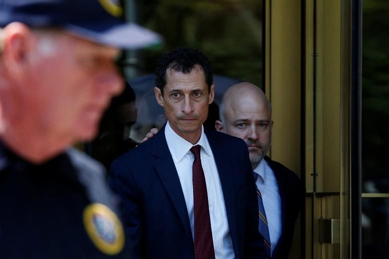 Anthony Weiner leaving a federal court with his lawyer on Friday after pleading guilty to sending explicit photos and messages to a 15-year-old schoolgirl last year.