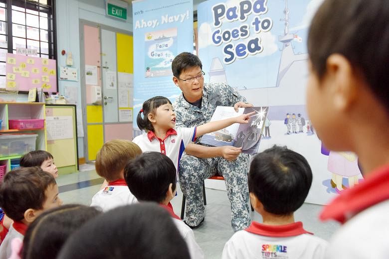 Major Lim Woon Huat of the Republic of Singapore Navy reading aloud from one of the children's books in the Ahoy, Navy! collection at a PCF Sparkletots Preschool yesterday. Navy personnel will do the same at various public libraries from May 27 to Ju