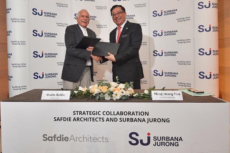 Mr Moshe Safdie and Mr Wong Heang Fine at a signing ceremony yesterday for the partnership between Surbana and Safdie Architects.