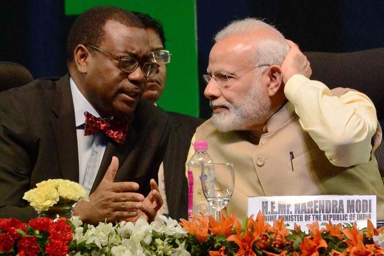 African Development Bank president Akinwumi Adesina and Indian Prime Minister Narendra Modi at the bank's meeting, the first major meeting of its kind between India and Africa since 2015.